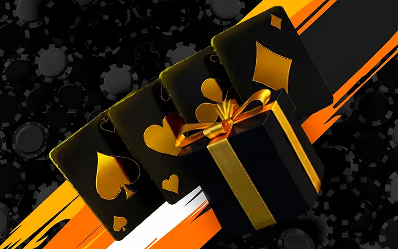 Cartas negras con palos dorados y una caja de regalo negra con un lazo dorado